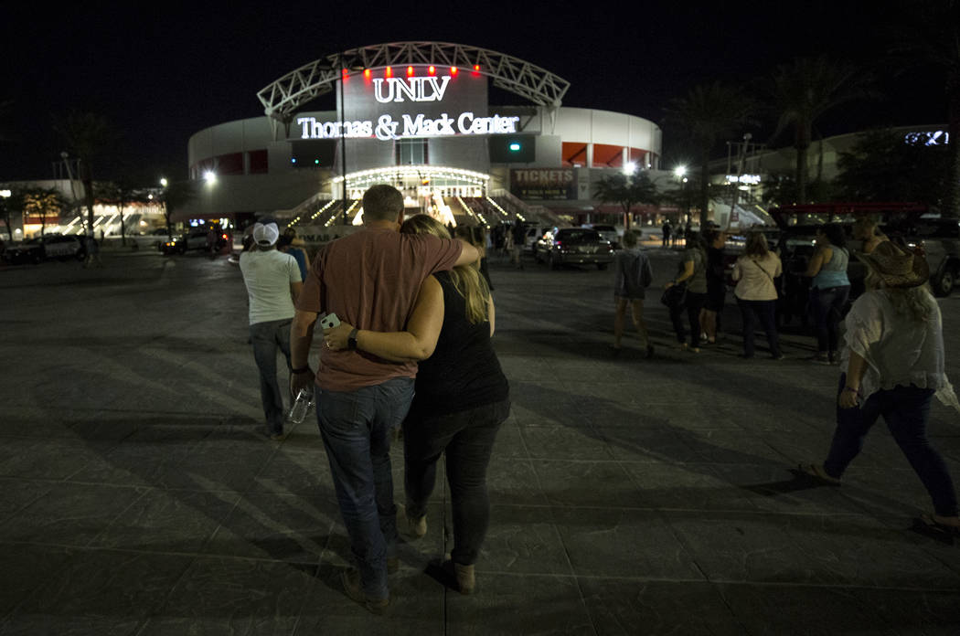 Festival-goers attending the Route 91 Harvest Festival were evacuated by bus to Thomas and Mack Arena early Monday morning, Oct. 2, 2017, following a shooting situation on the Las Vegas Strip. Ric ...