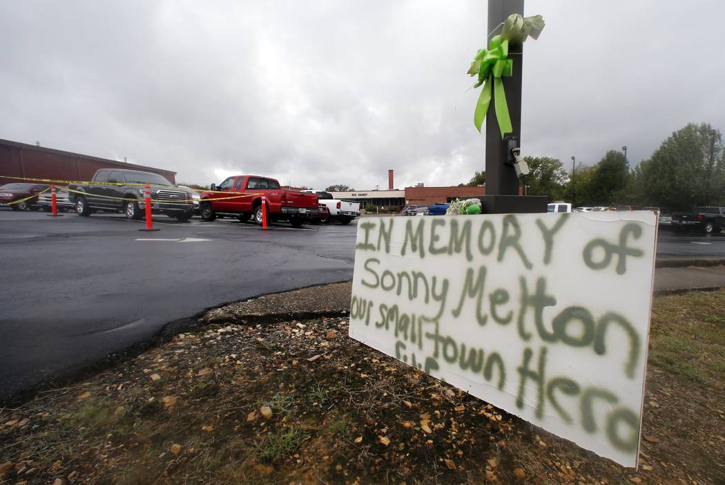 A sign is seen outside the school before the funeral for Sonny Melton Tuesday, Oct. 10, 2017, i ...