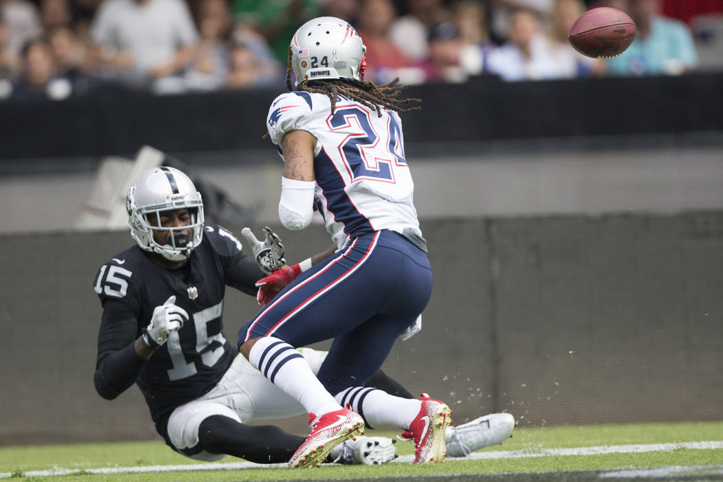 Oakland Raiders wide receiver Michael Crabtree (15) misses a catch in the end zone against New England Patriots cornerback Stephon Gilmore (24) in the NFL football game at Estadio Azteca in Mexico ...