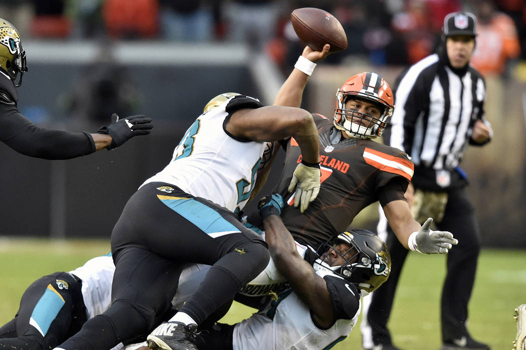 Cleveland Browns quarterback DeShone Kizer (7) is sacked in the second half of an NFL football game against the Jacksonville Jaguars, Sunday, Nov. 19, 2017, in Cleveland. (AP Photo/David Richard)