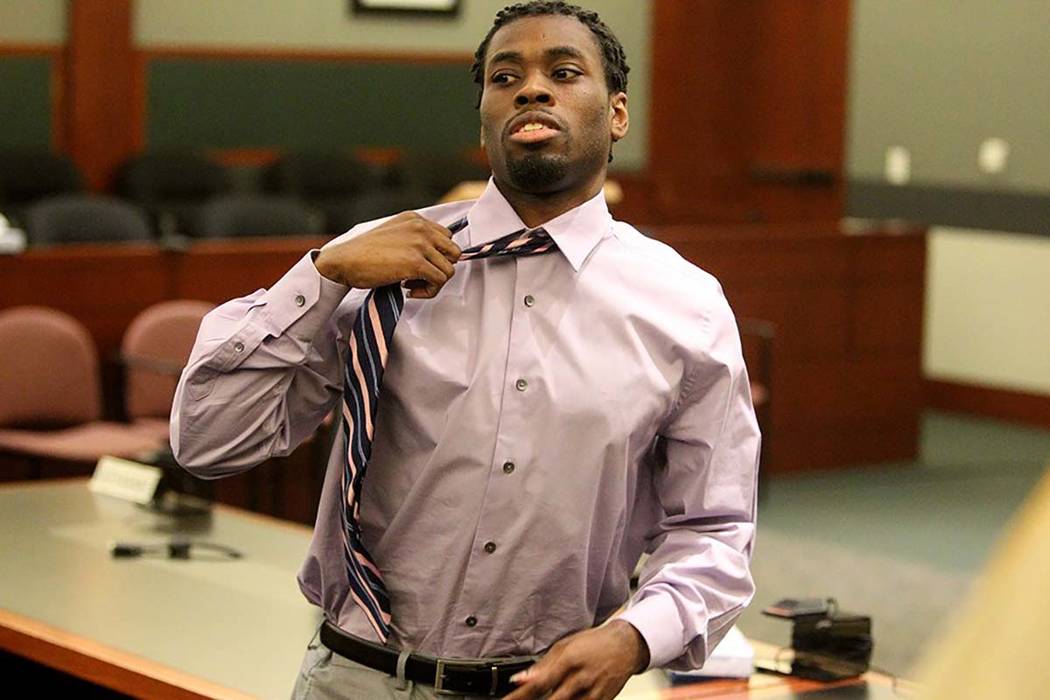Bryan Clay removes his tie after being found guilty of the murders and rapes of Ignacia “Yadira” Martinez, 38, and her 10-year-old daughter, Karla in 2012, in District Court in Las Vegas on Tu ...