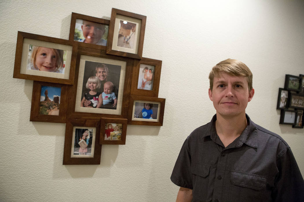 Shane Peterson stands next to images of his daughters at his home in Henderson on Nov. 15, 2017 ...