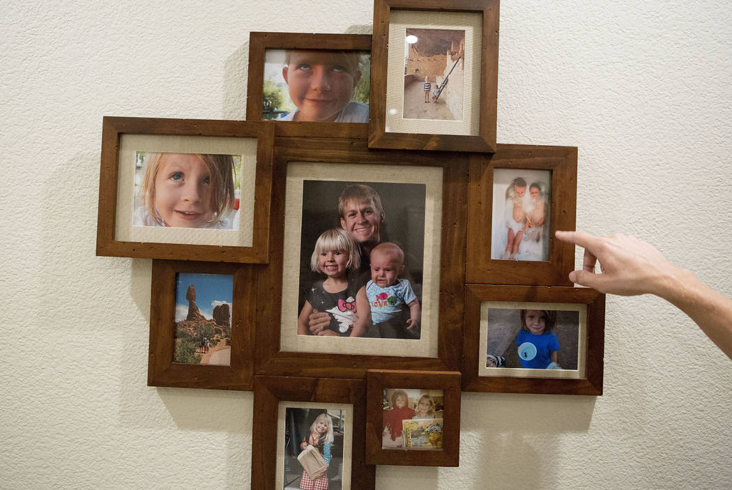 Shane Peterson points to images of his daughters at his home in Henderson on Nov. 15, 2017. Bri ...