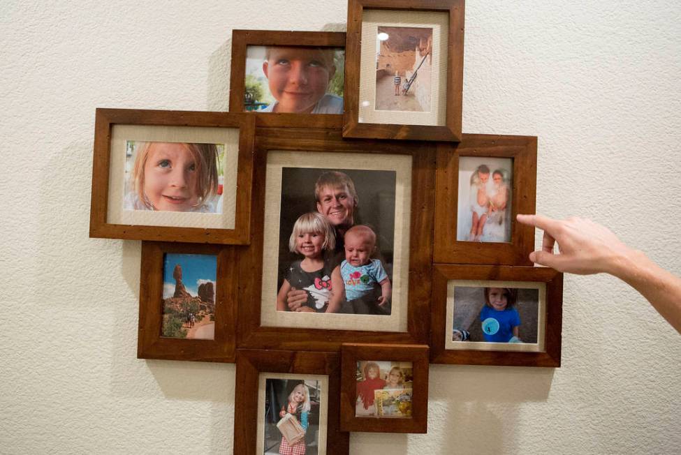 Shane Peterson points to images of his daughters at his home in Henderson on Nov. 15, 2017. Bri ...