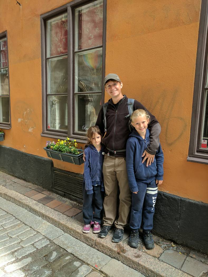 Shane Peterson with his two daughters, Frida, left, and Clara, during a trip to Stockholm, Swed ...