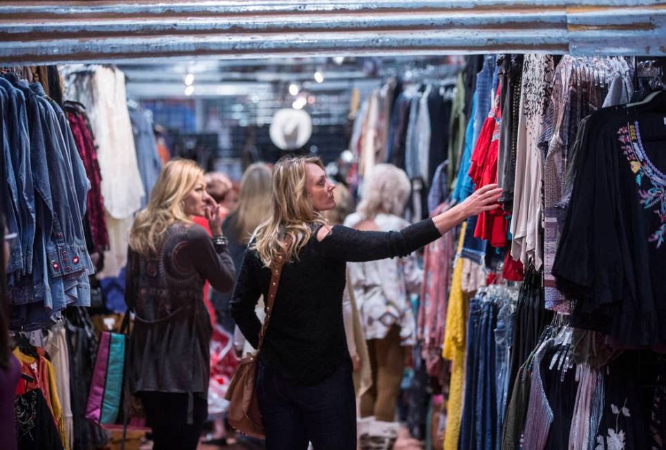 Toronto, Canada resident Jaime Robertson shops at Cattilac Style during Cowboy Christmas on Thu ...