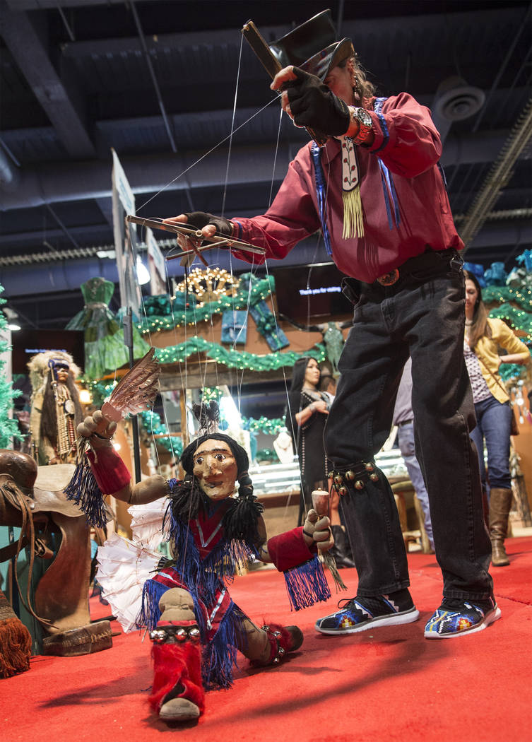 Buddy Big Mountain, right, performs with his marionette "Tony Chases Porcupine" durin ...