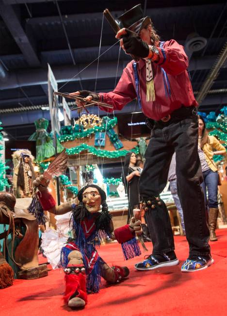 Buddy Big Mountain, right, performs with his marionette "Tony Chases Porcupine" durin ...