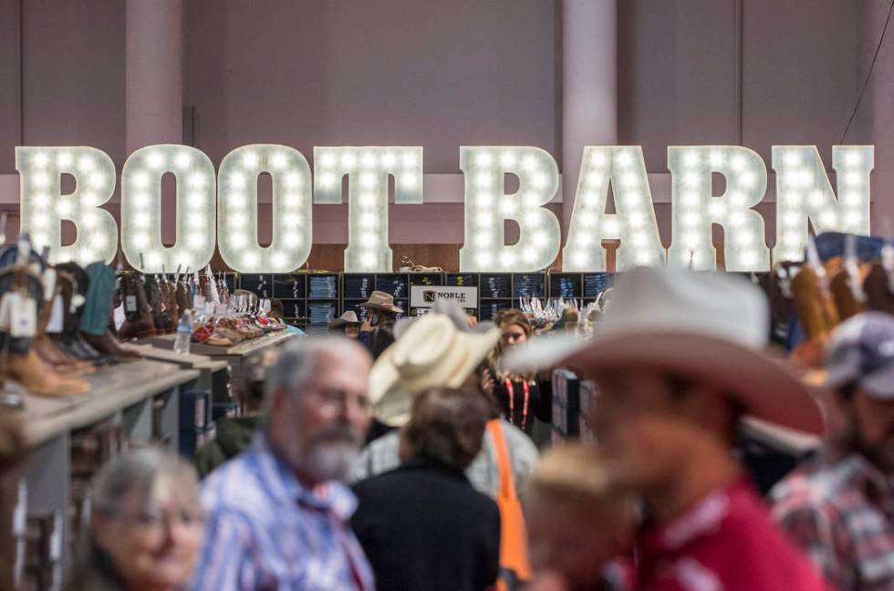 Shoppers peruse the aisles at Boot Barn during Cowboy Christmas on Thursday, Dec. 7, 2017, at t ...