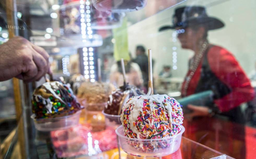 Fresh candy apples at Lisa's Rodeo Time Fudge & Candy at Cowboy Christmas on Thursday, Dec. ...