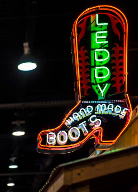 Neon signage marks Leddy Hand Made Boots during Cowboy Christmas on Thursday, Dec. 7, 2017, at ...