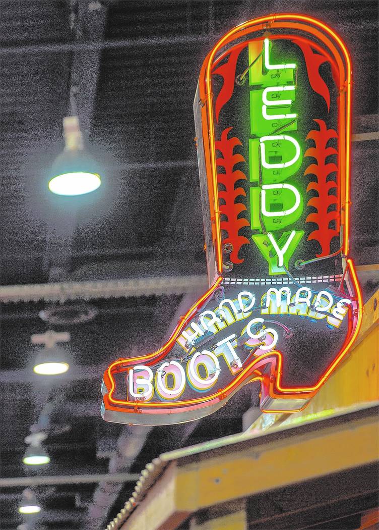 Neon signage marks Leddy Hand Made Boots during Cowboy Christmas on Thursday, Dec. 7, 2017, at ...