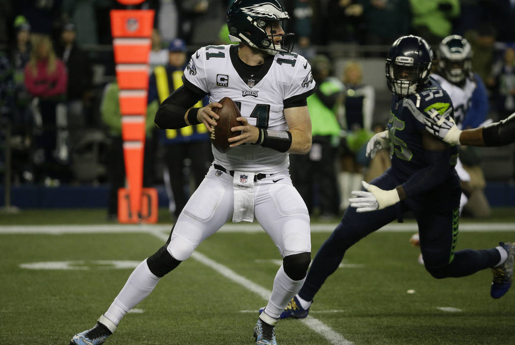Philadelphia Eagles quarterback Carson Wentz in action against the Seattle Seahawks in the first half of an NFL football game, Sunday, Dec. 3, 2017, in Seattle. (AP Photo/Ted S. Warren)