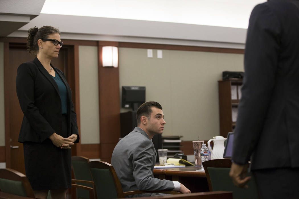 Defense attorney Monique McNeill, left, with her client Joshua Honea, a former Las Vegas police ...