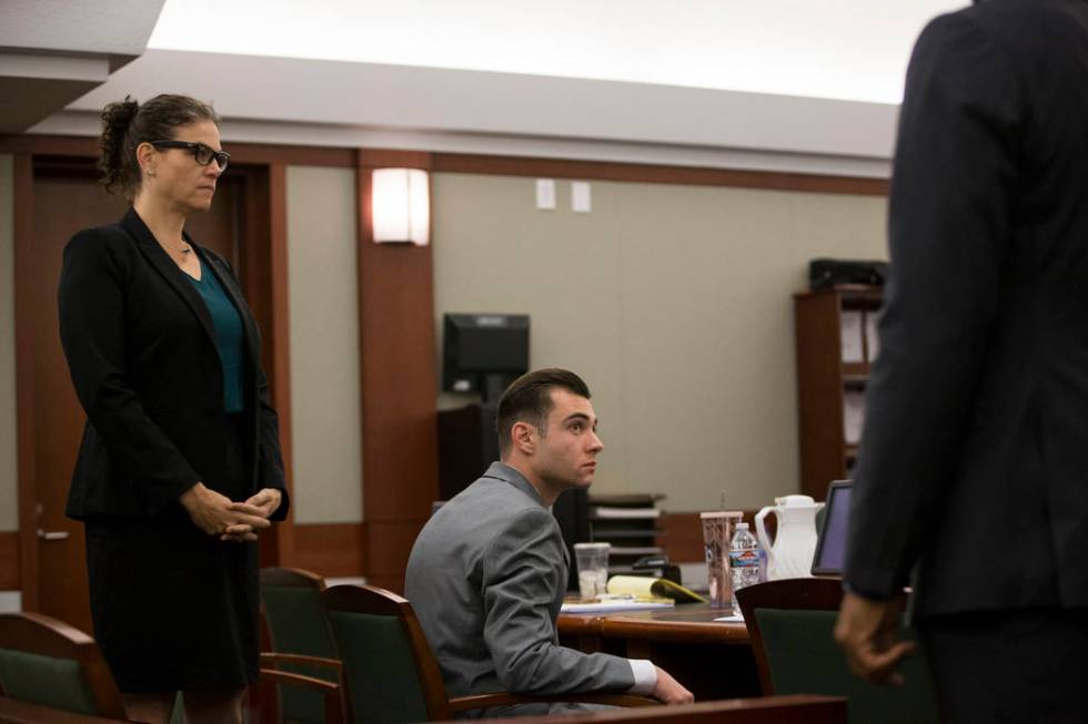 Defense attorney Monique McNeill, left, with her client Joshua Honea, a former Las Vegas police ...