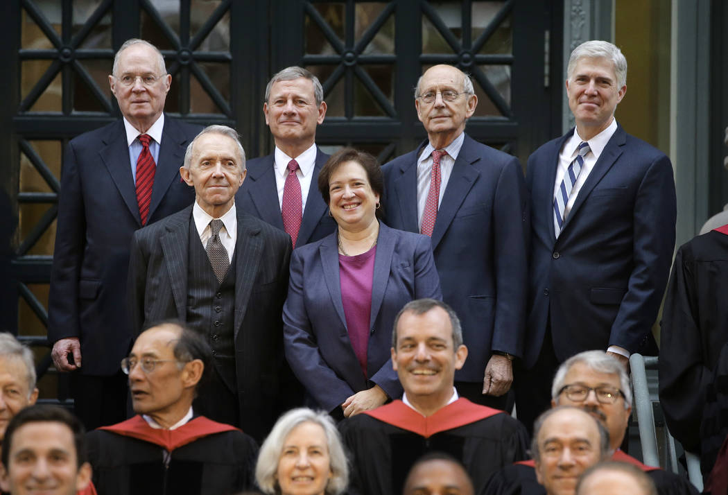 Justices of the U.S. Supreme Court, Associate Justice Elena Kagan, center right, and top row from left, Associate Justice Anthony Kennedy, Chief Justice John Roberts, Associate Justice Stephen Bre ...