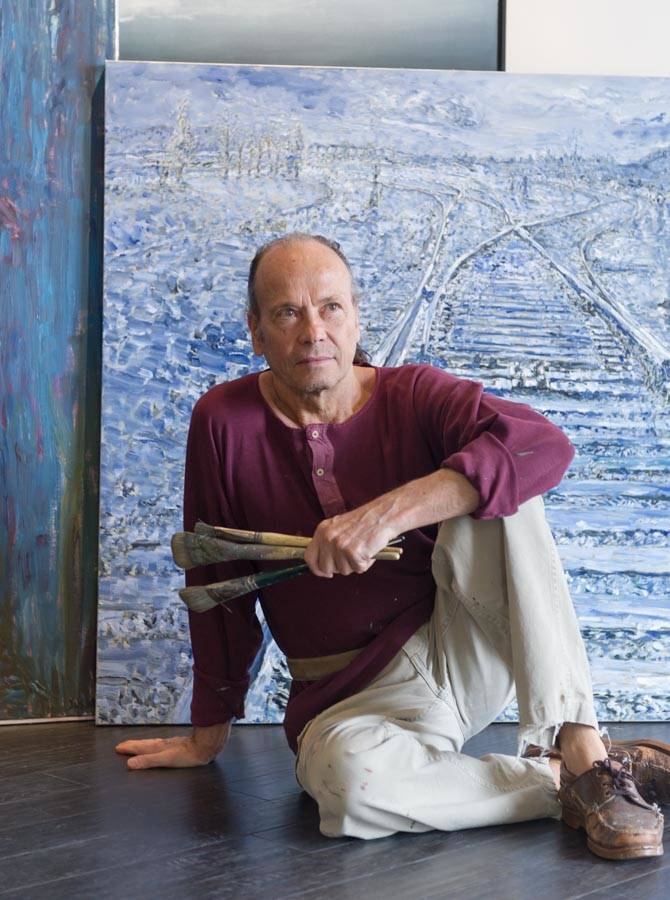 Marco Sassone, 75, poses in front of one of his paintings. Photo courtesy of Marco Sassone.