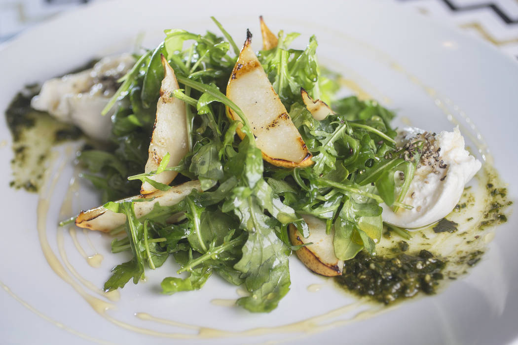 Grilled pear and burrata with arugula, black pepper honey and basil pesto at 7th & Carson on Thursday, December 21, 2017, in Las Vegas. Benjamin Hager Las Vegas Review-Journal @benjaminhphoto