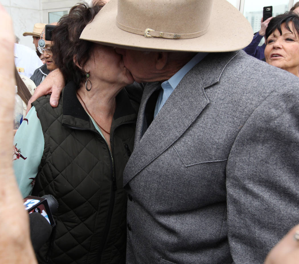 Cliven Bundy kisses his wife, Carol after walking out of Lloyd George U.S. Courthouse in Las Vegas a free man Monday, Jan. 8, 2017, after a federal judge dismissed the case with prejudice against  ...