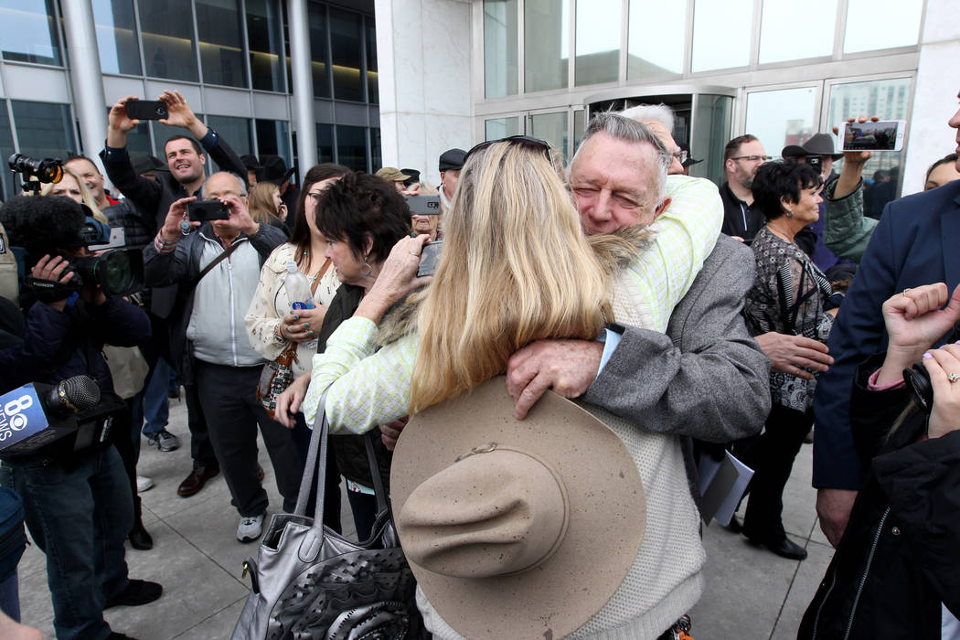 Cliven Bundy hugs a supporter after walking out of Lloyd George U.S. Courthouse in Las Vegas a free man Monday, Jan. 8, 2017, after a federal judge dismissed the case with prejudice against him, t ...