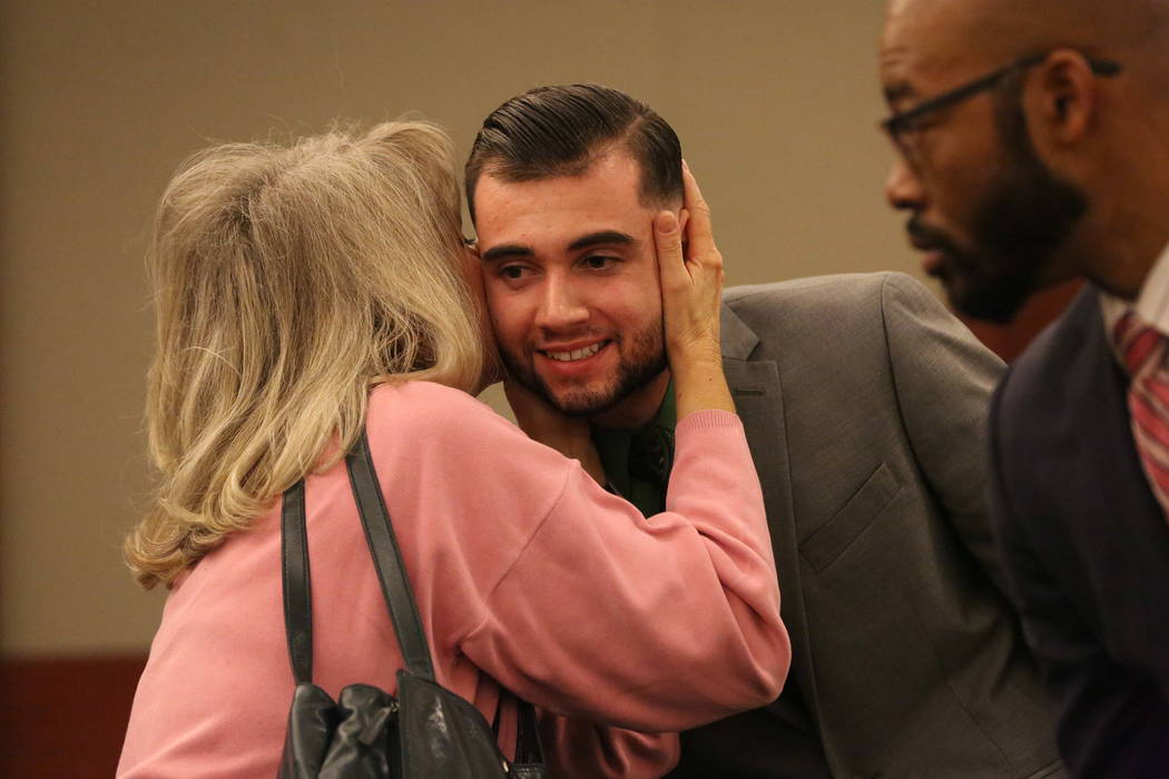Joshua Honea, the former police Explorer convicted in December of sexual assault of a minor, receives an embrace from a family friend after his hearing to request a new trial at the Regional Justi ...
