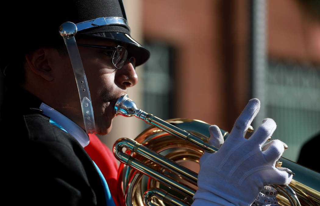 Carlos Lemus, a 15-year-old baritone player from Western High School, practices before marching in the 36th annual Dr. Martin Luther King Jr. Parade, themed "Living the Dream: Building a Bridge to ...