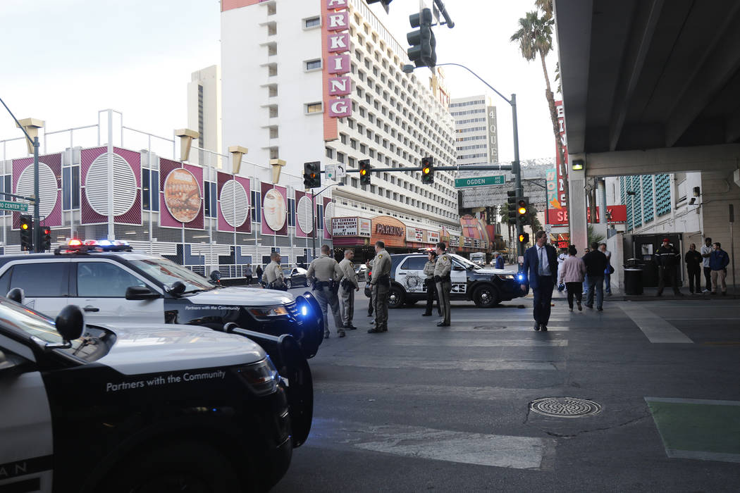 Cop cars on Ogden and Casino Center near the Fremont Street Experience in Las Vegas, Monday, Jan. 15, 2018. A large fight occurred nearby with around 100 people involved and eight were detained, a ...