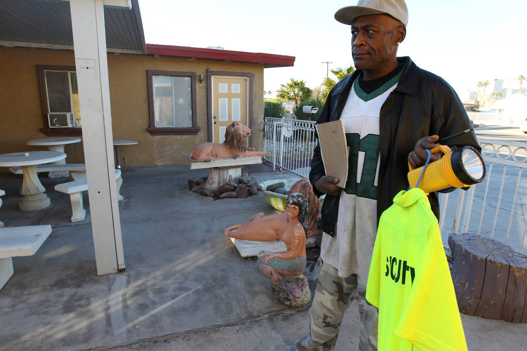 Jeff Woods, who is a security guard at 724 N. 9th St. in downtown Las Vegas, talks to a reporter at the property Friday, Jan. 26, 2018. The home was part of a Nevada state program that pays provid ...