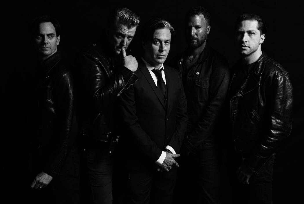 Queens of the Stone Age frontman Josh Homme, second from left, has been known to play the heel from time-to-time on stage. (Queens of the Stone Age)
