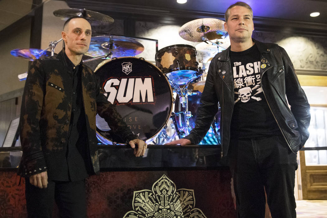 Artist Shepard Fairey, right, and Sum 41 drummer Frank Zummo take photos with a custom drumkit/art project called Rise Above on Friday, February 16, 2018, at The Hard Rock hotel-casino, in Las Veg ...