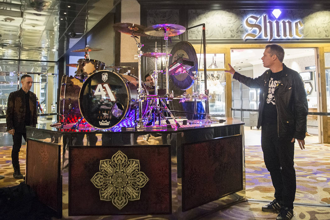 Artist Shepard Fairey, right, and Sum 41 drummer Frank Zummo point out features of a custom a drumkit/art project called Rise Above on Friday, February 16, 2018, at The Hard Rock hotel-casino, in  ...