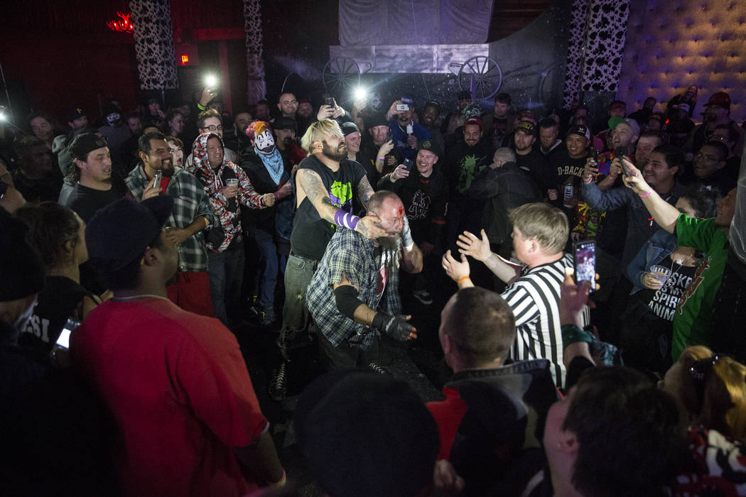 Chuey Martinex, left/middle, battles with Homeless Jimmy during their JCW wrestling match at Insane Clown Posse's Juggalo Weekend on Saturday, February 17, 2018, at Backstage Bar & Billiards,  ...