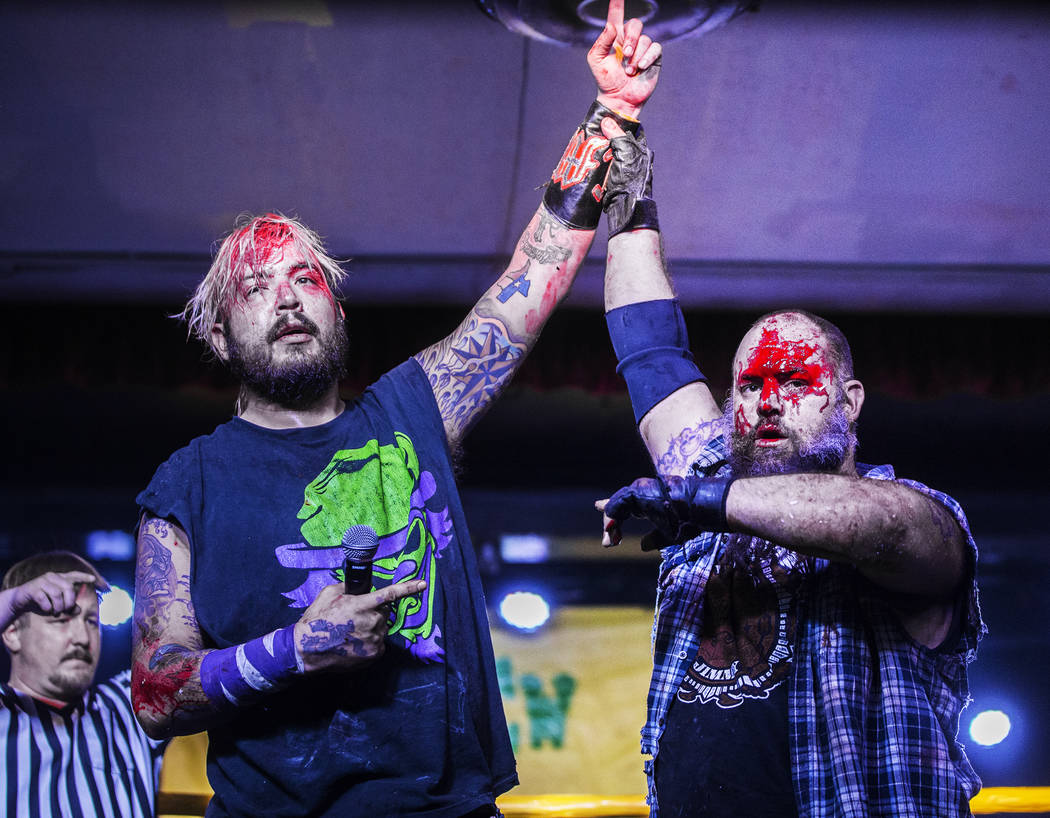 Chuey Martinex, left, celebrates after defeating  Homeless Jimmy at the conclusion of their JCW wrestling match at Insane Clown Posse's Juggalo Weekend on Saturday, February 17, 2018, at Backstage ...