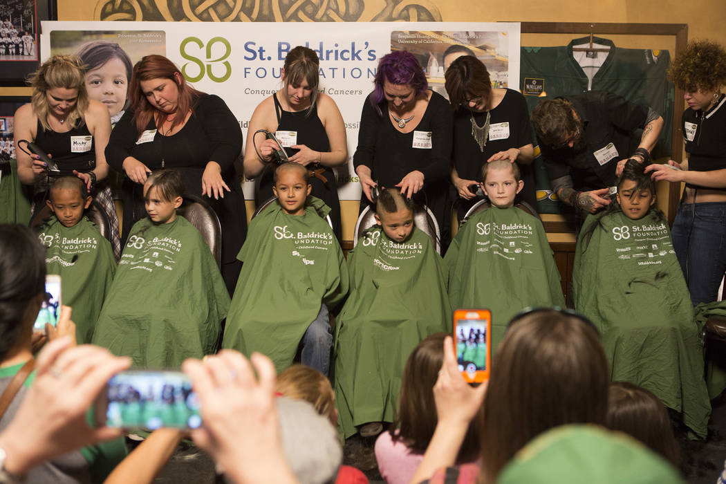 Kids get their head shaved in part of "Shave for the Cure" a St. Baldrick's event held at McMullan's Irish Pub on Saturday, March 4, 2017, in Las Vegas.(Bridget Bennett/Las Vegas Review- ...