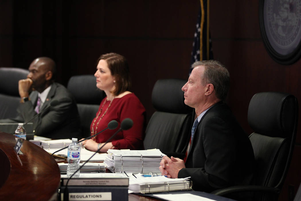 Gaming Control Board members, from left, Terry Johnson, chairwoman Becky Harris and Shawn Reid listen to testimony from Alex Meruelo who was requisition a gaming license transfer for the SLS in th ...