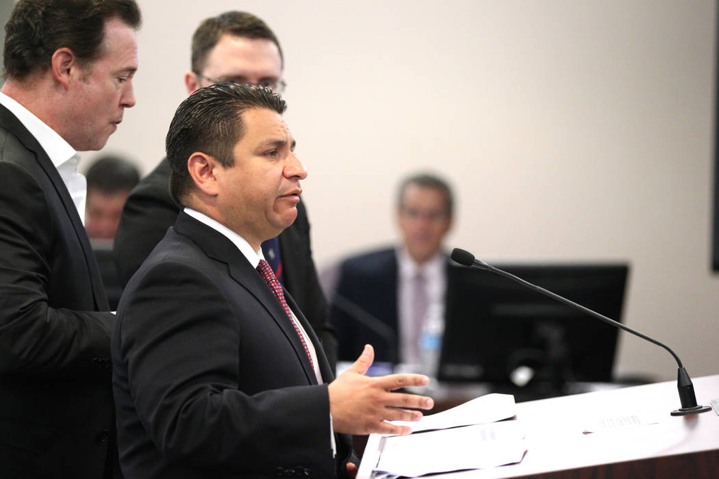 Benjamin Vega, general counsel of the Meruelo Group, right, speaks to the Gaming Control Board on behalf of Alex Meruelo, left, in the Sawyer Building in Las Vegas Wednesday, March 7, 2018. The bo ...