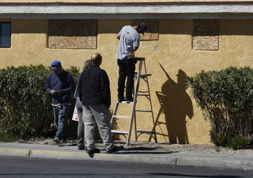 Workers board up windows with plywood at Las Haciendas Apartments at 2504 Las Vegas Blvd. North on Monday, March 5, 2018. Twenty-five families were evicted from their apartments. Bizuayehu Tesfaye ...