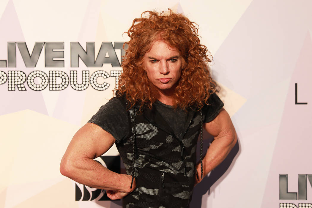 Carrot Top, a comedian and MGM Resorts Entertainmer, poses before a VIP screening of "Believer," the documentary by Imagine Dragons frontman, Reynolds, at KA Theatre at MGM Grand in Las  ...