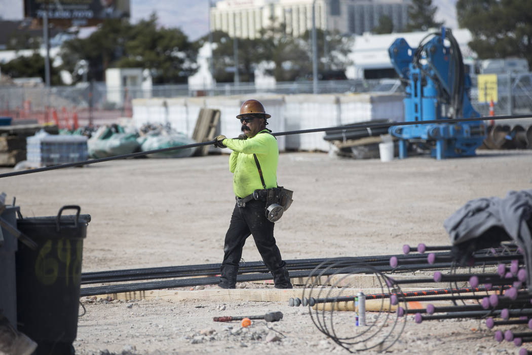 A worker handles a steel rod at the future Raiders stadium site in Las Vegas, Tuesday, March 6, 2018. (Erik Verduzco/Las Vegas Review-Journal) @Erik_Verduzco