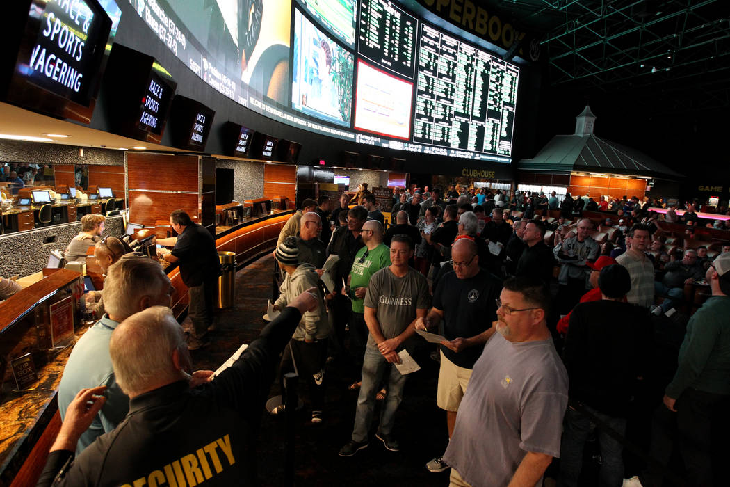 Guests watch and line up to bet on basketball games during the NCAA Tournament at the Westgate Superbook in Las Vegas Thursday, March 15, 2018. K.M. Cannon Las Vegas Review-Journal @KMCannonPhoto
