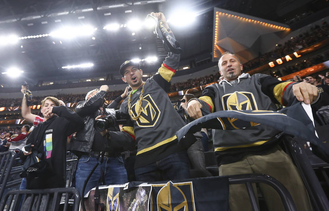 Golden Knights fans celebrate a goal by center William Karlsson (71) against the Colorado Avalanche in the final moments of the third period of an NHL hockey game at T-Mobile Arena in Las Vegas on ...