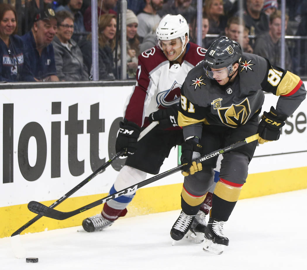 Golden Knights center Jonathan Marchessault (81) controls the puck as Colorado Avalanche defenseman Mark Alt (7) defends during the third period of an NHL hockey game at T-Mobile Arena in Las Vega ...