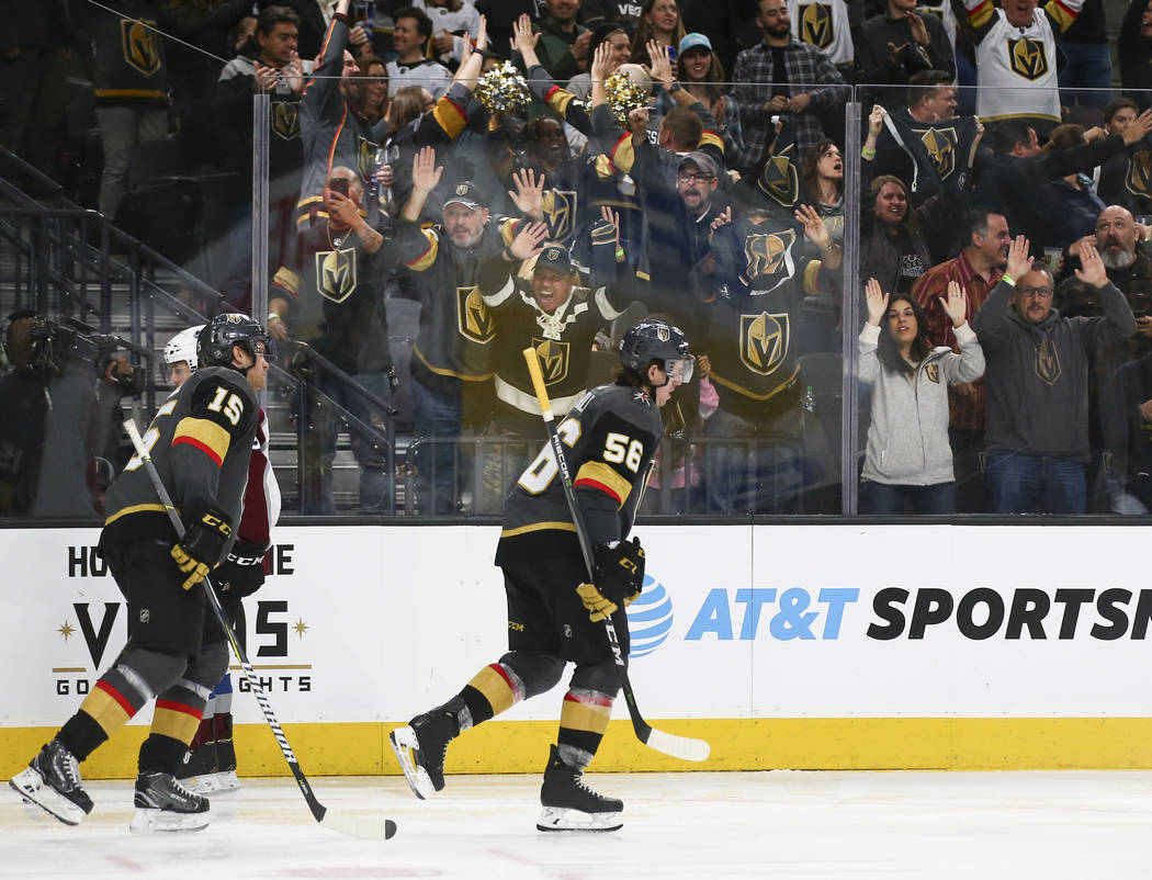 Golden Knights players celebrate a goal by Golden Knights defenseman Shea Theodore, not pictured, during the third period of an NHL hockey game against the Colorado Avalanche at T-Mobile Arena in  ...