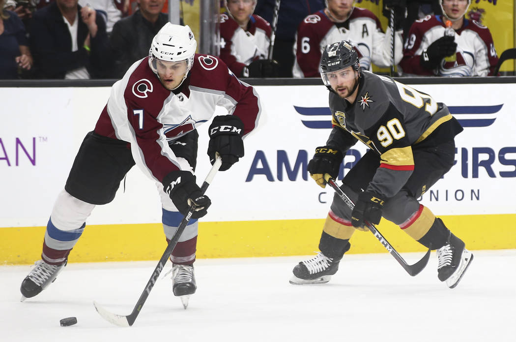 Colorado Avalanche defenseman Mark Alt (7) controls the puck as Golden Knights left wing Tomas Tatar (90) looks on during the third period of an NHL hockey game at T-Mobile Arena in Las Vegas on M ...