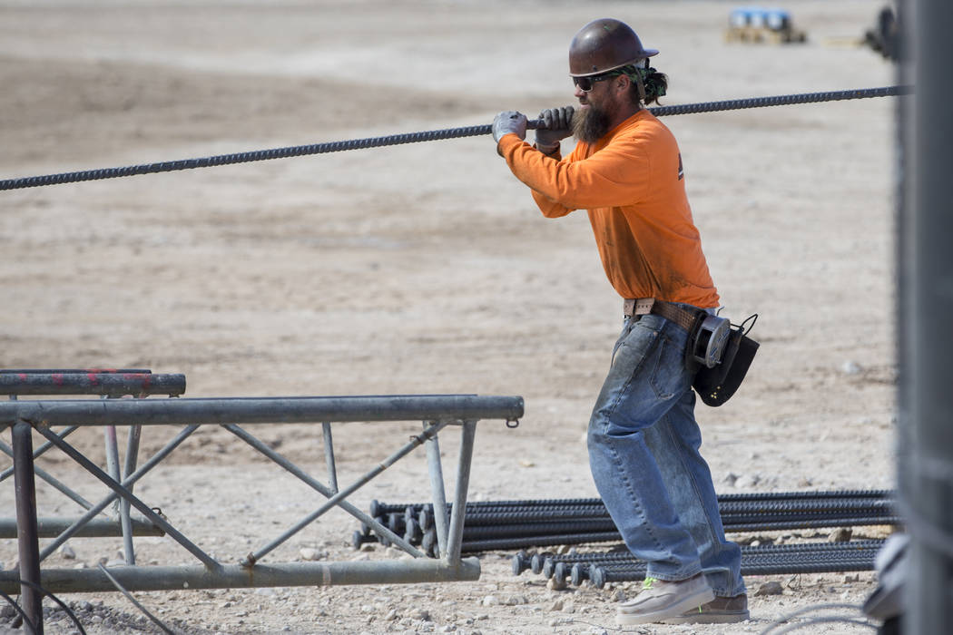 A worker handles steel rod at the future Raiders stadium site in Las Vegas, Tuesday, March 6, 2018. Erik Verduzco Las Vegas Review-Journal @Erik_Verduzco
