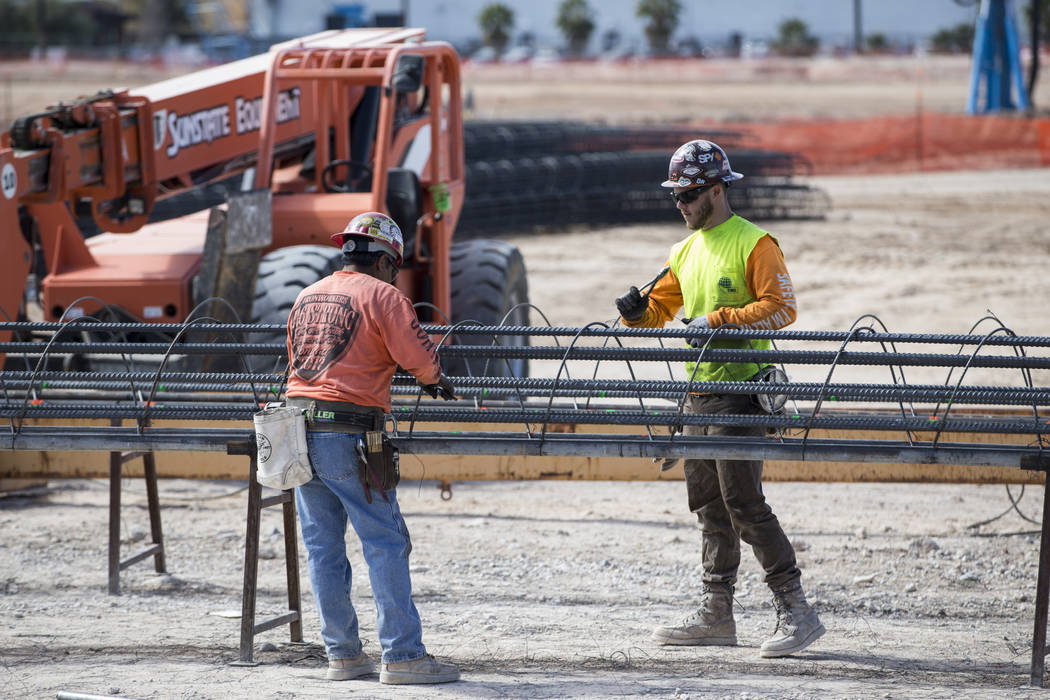 Workers handle steel rods at the future Raiders stadium site in Las Vegas, Tuesday, March 6, 2018. Erik Verduzco Las Vegas Review-Journal @Erik_Verduzco