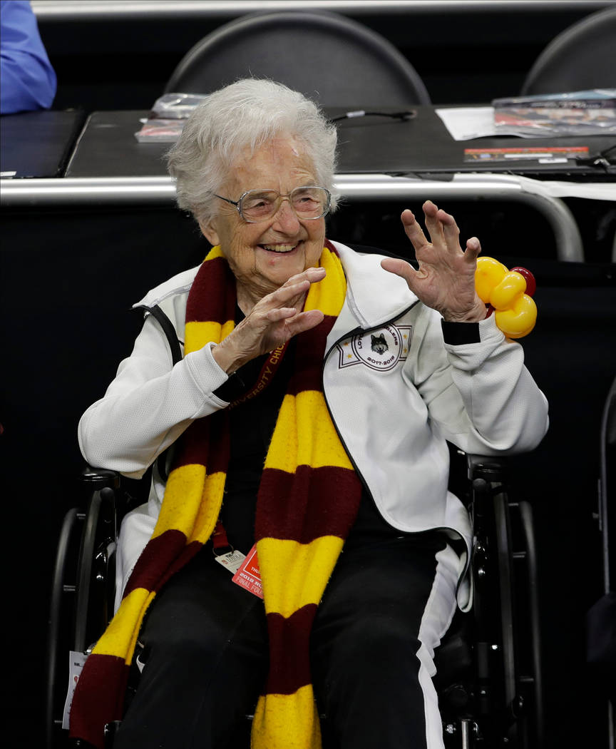 Loyola-Chicago's Sister Jean Dolores Schmidt watches as players warm up before the semifinal game against Michigan in the Final Four NCAA college basketball tournament, Saturday, March 31, 2018, i ...