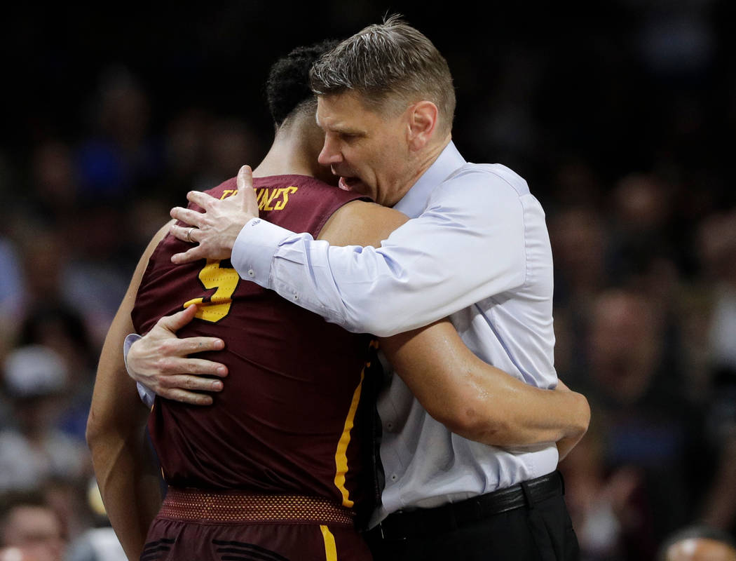 Loyola-Chicago head coach Porter Moser hugs Marques Townes (5) during the second half in the semifinals of the Final Four NCAA college basketball tournament against Michigan, Saturday, March 31, 2 ...