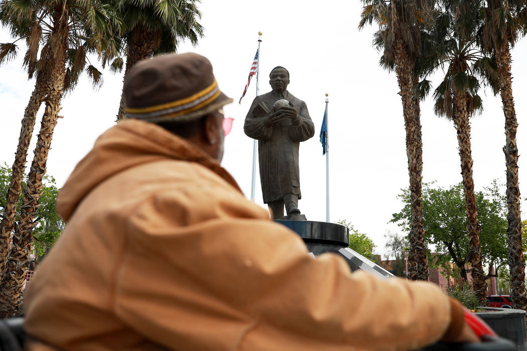 Walter "Mista" Kinchen looks at the Martin Luther King Jr. statue near the intersection of Martin Luther King Boulevard and Carey Avenue in North Las Vegas on March 21, 2018. (Andrea Cornejo/Las V ...