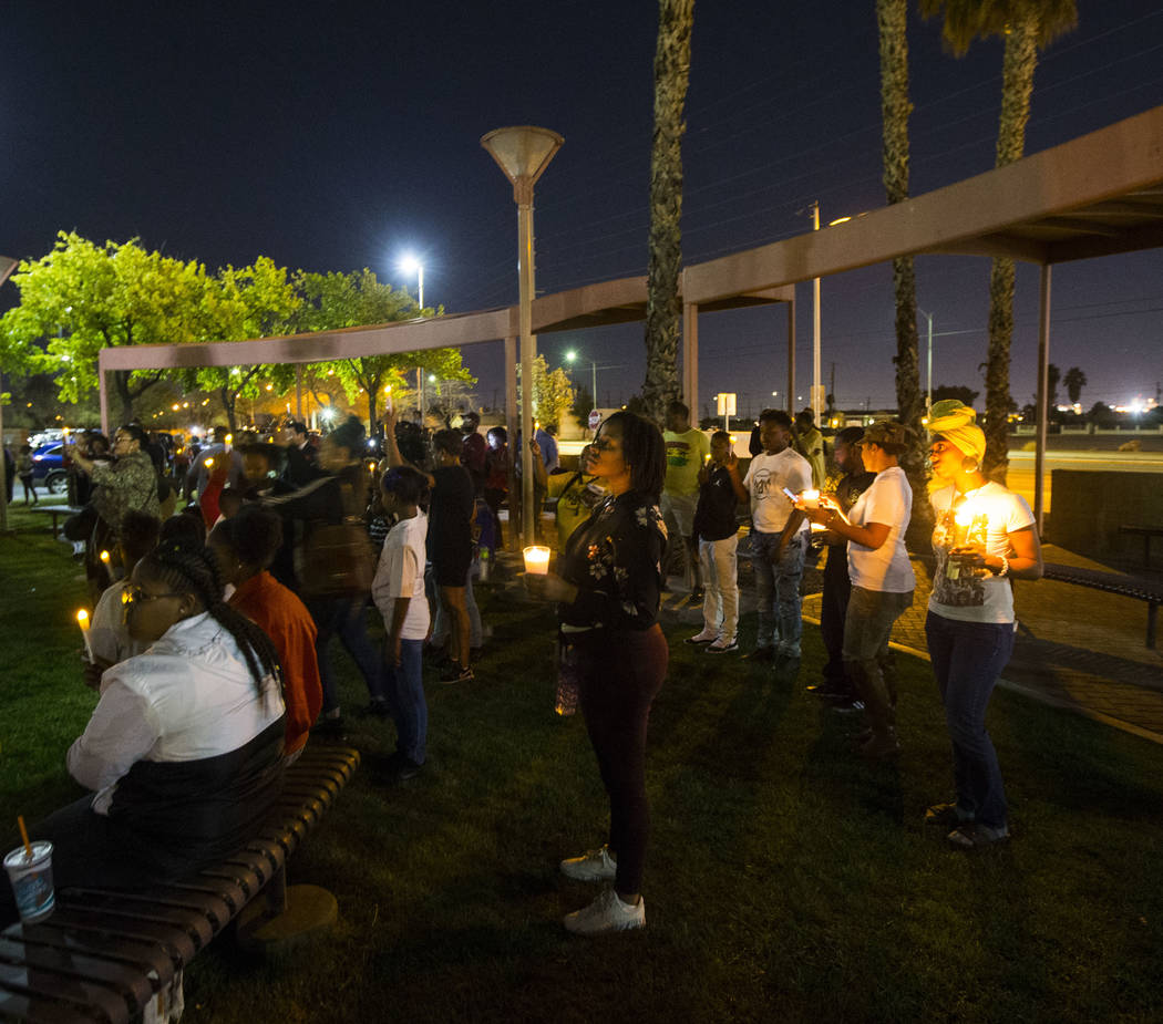 Attendees hold up candles during a vigil held in honor of Dr. Martin Luther King Jr. at the statue made in his memory in North Las Vegas on Wednesday, April 4, 2018. Chase Stevens Las Vegas Review ...